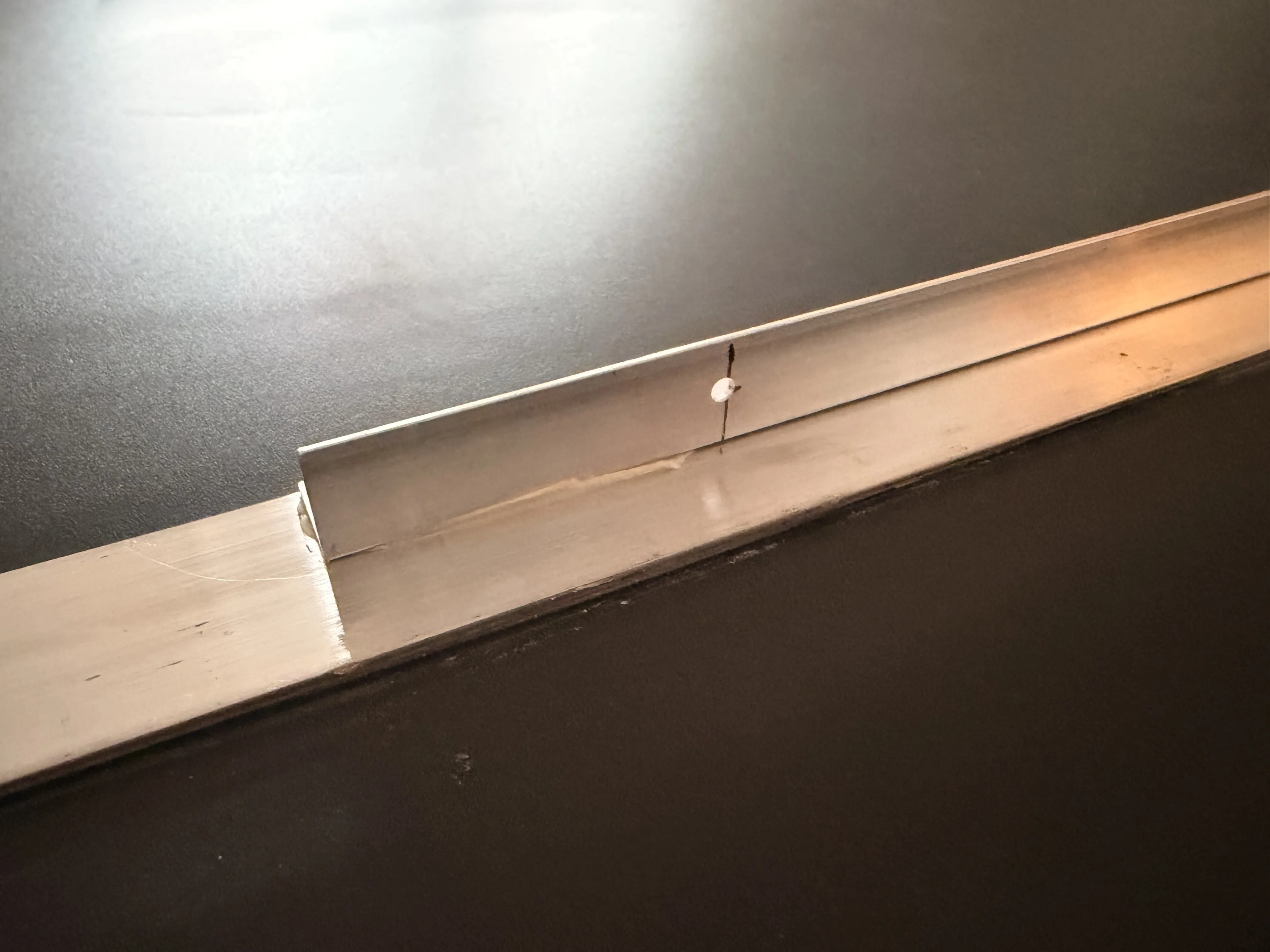 L-profile reinforcement glued to the back for stiffness